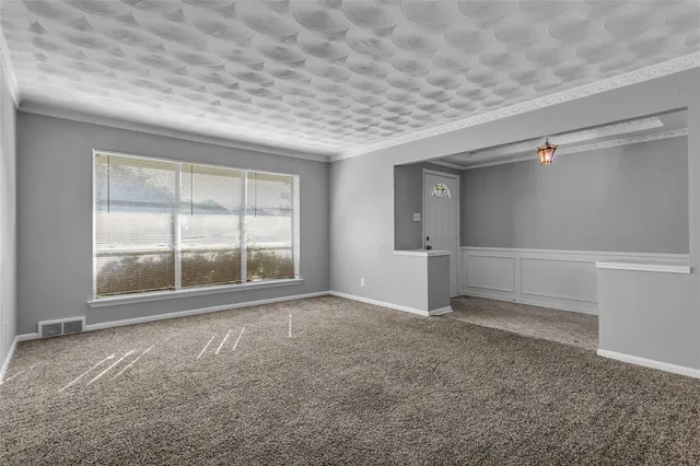 a view of a hallway with a chandelier