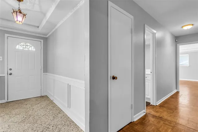 a view of hallway with livingroom and hardwood floor