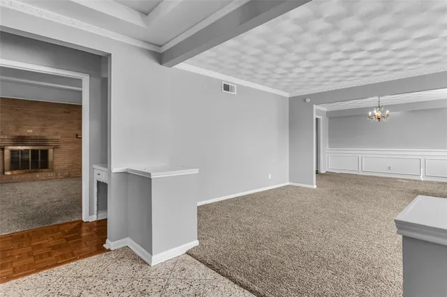 a view of an empty room with a fireplace