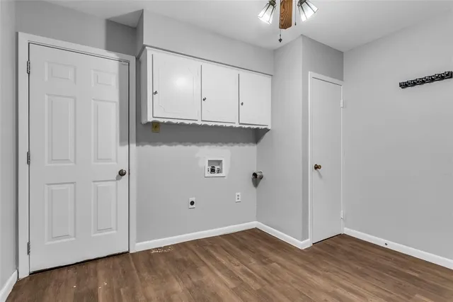 a view of a kitchen with microwave and cabinets