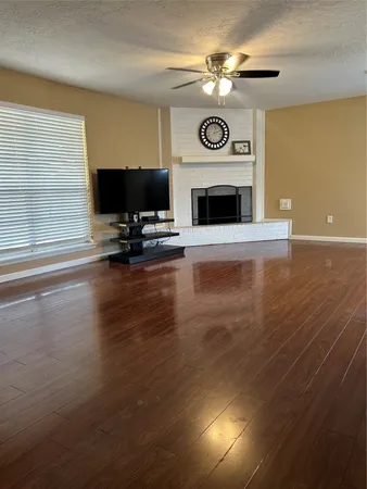 a view of a livingroom with furniture and a fireplace