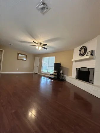 a view of a livingroom with furniture a fireplace