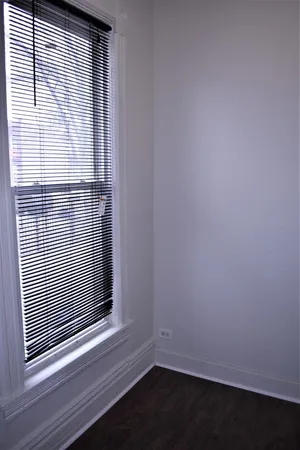 a view of wooden floor and a window