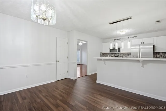 a view of kitchen with wooden floor