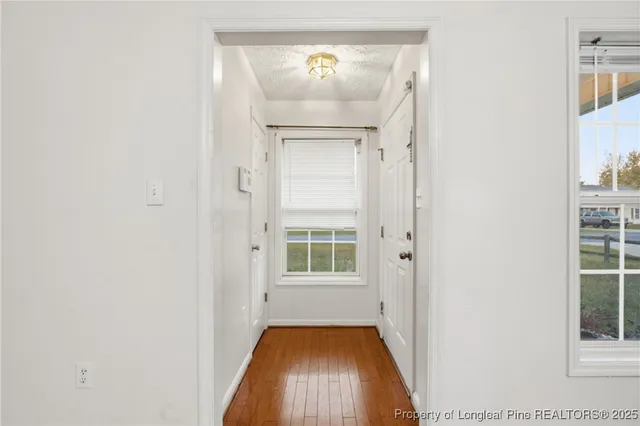 a view of a hallway with windows
