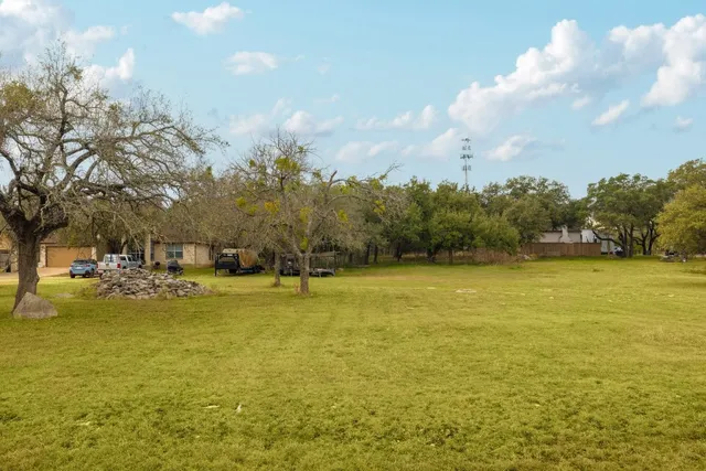 a backyard of a house with lots of green space
