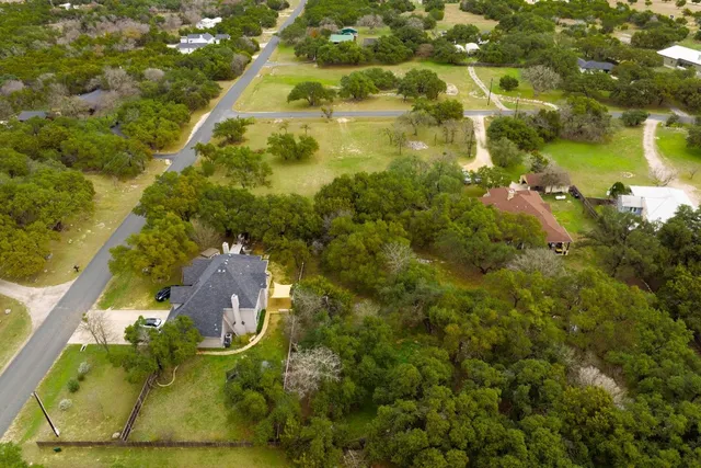a view of swimming pool with a tree
