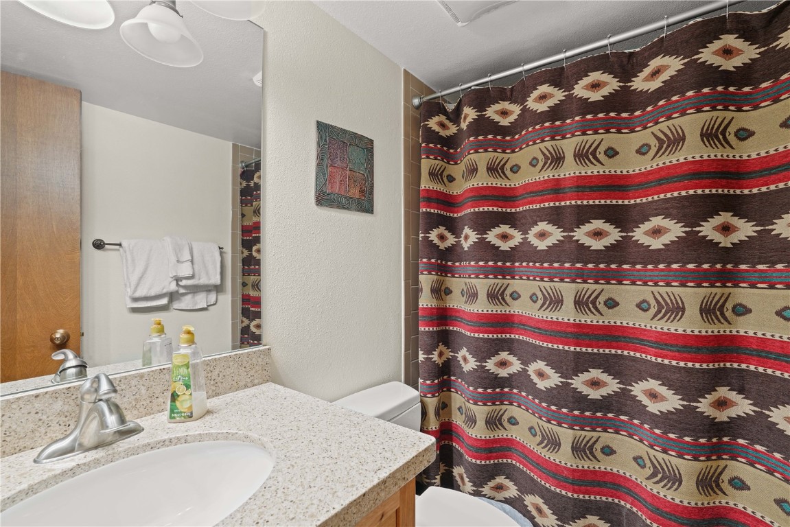 800 Copper Road, Unit 206 Copper Mountain, CO 80443 - Photo 18 of 22 a bathroom with a bathtub and a sink