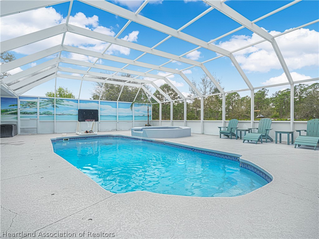 5721 Golden Road Sebring, FL 33875 - Photo 30 of 42 Decorative Privacy Screen + Large deck area for lounging, table space & entertaining