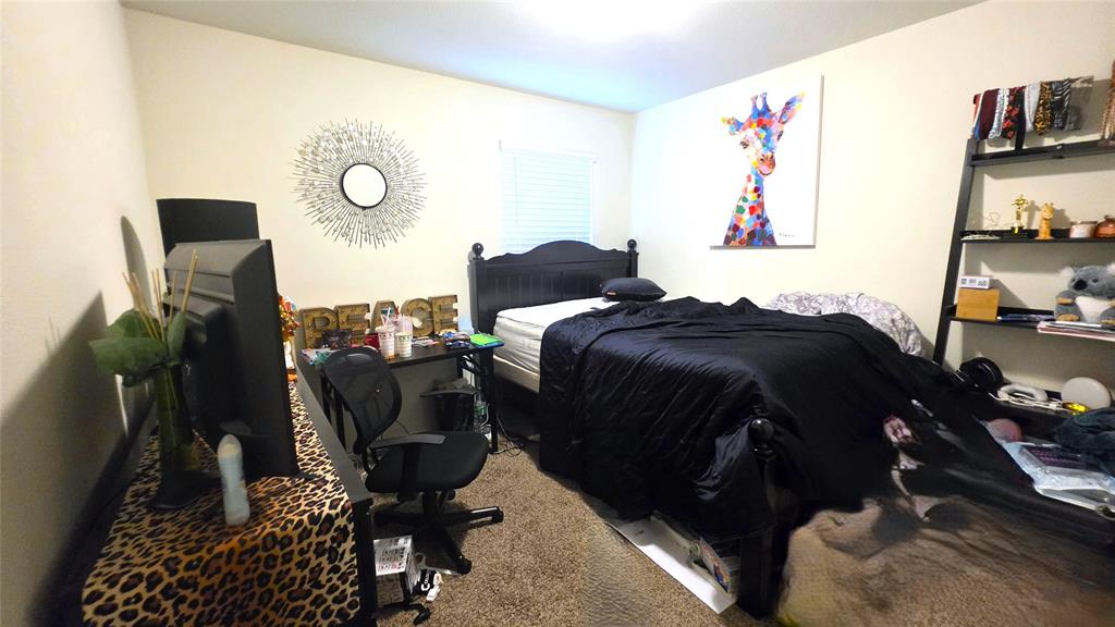 409 Samuel Street Denton, TX 76207 - Photo 17 of 40 a living room with furniture and a painting on the wall