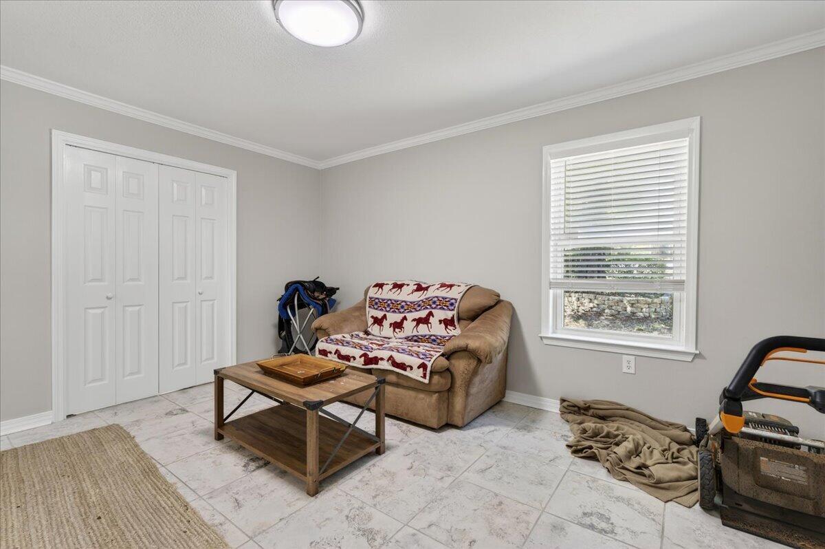 210 Shell Drive Crestview, FL 32536 - Photo 15 of 67 a bedroom with furniture and a window