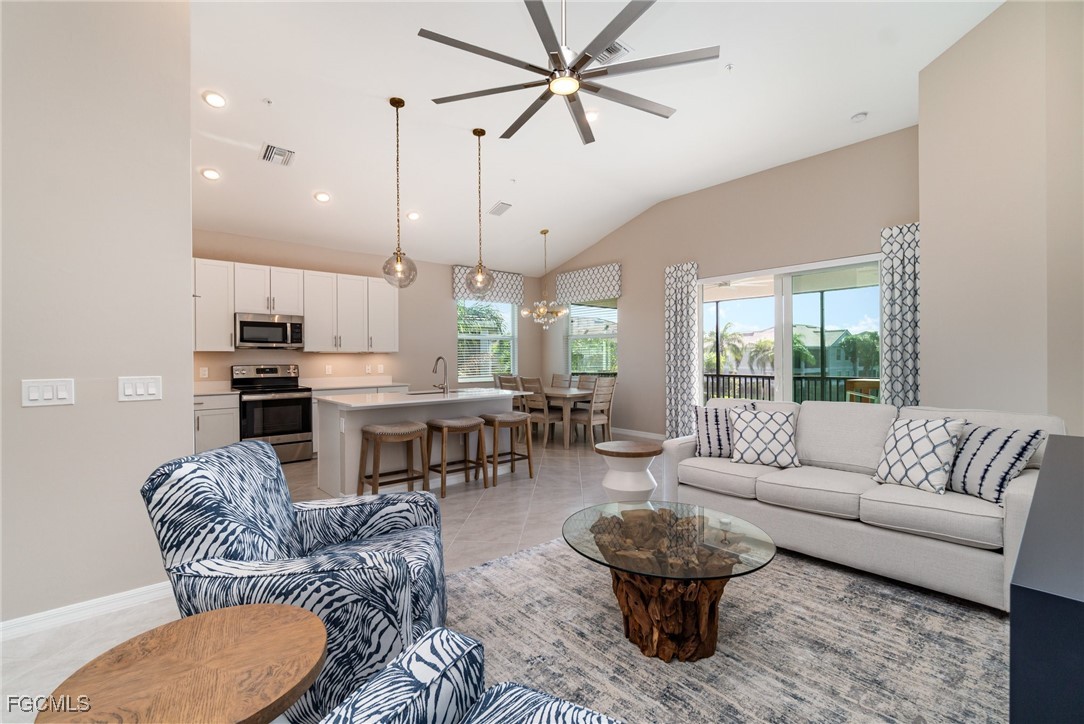 a living room with furniture and a large window