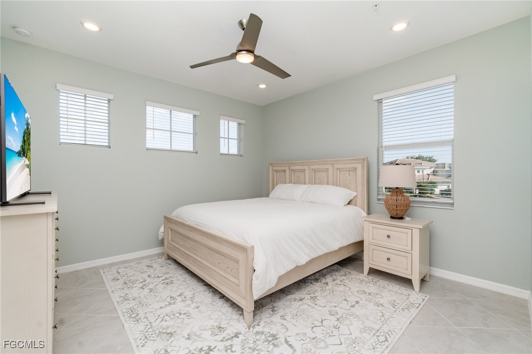 3771 Pebblebrook Ridge Court, Unit 201 Fort Myers, FL 33905 - Photo 16 of 45 a bedroom with a bed and a window