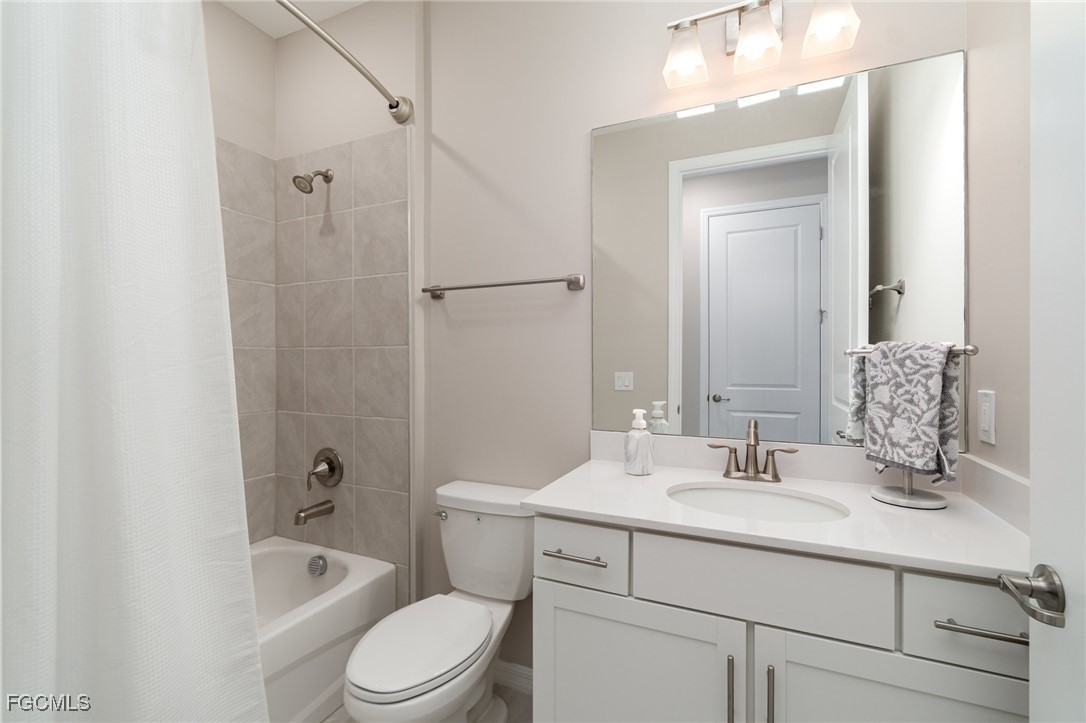 3771 Pebblebrook Ridge Court, Unit 201 Fort Myers, FL 33905 - Photo 18 of 45 a bathroom with a sink a toilet and shower