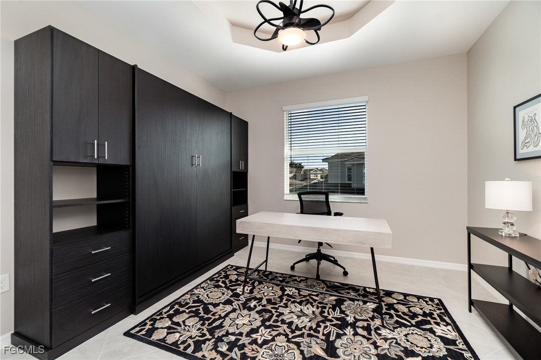 3771 Pebblebrook Ridge Court, Unit 201 Fort Myers, FL 33905 - Photo 19 of 45 a living room with a black furniture and a window