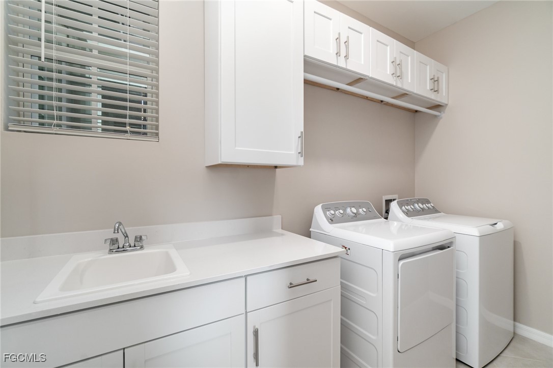 3771 Pebblebrook Ridge Court, Unit 201 Fort Myers, FL 33905 - Photo 21 of 45 a utility room with dryer and washer