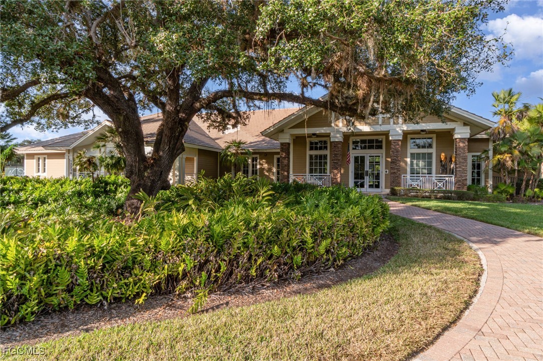 3771 Pebblebrook Ridge Court, Unit 201 Fort Myers, FL 33905 - Photo 36 of 45 front view of a house with a garden