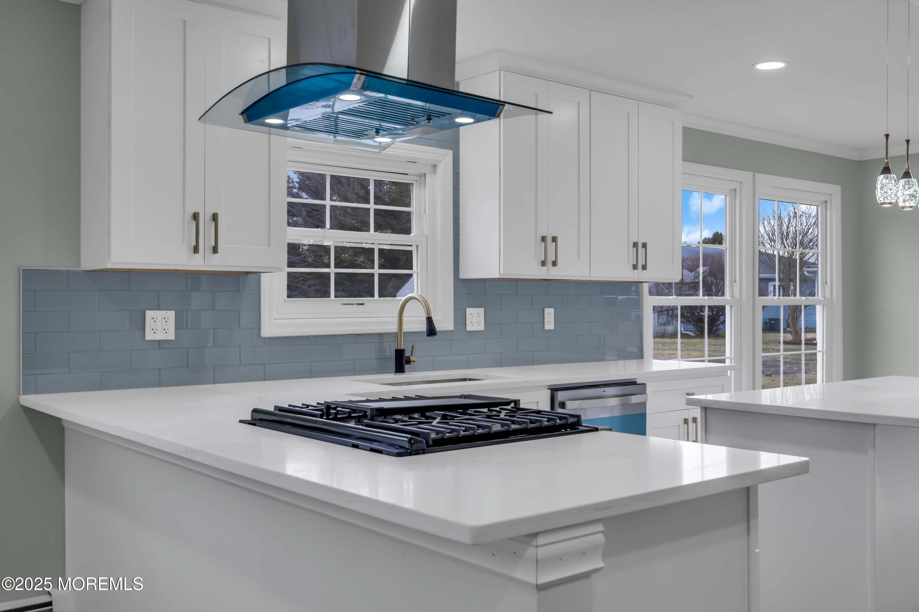 10 Aztec Court Toms River, NJ 08757 - Photo 29 of 57 a kitchen with a stove a window and cabinets