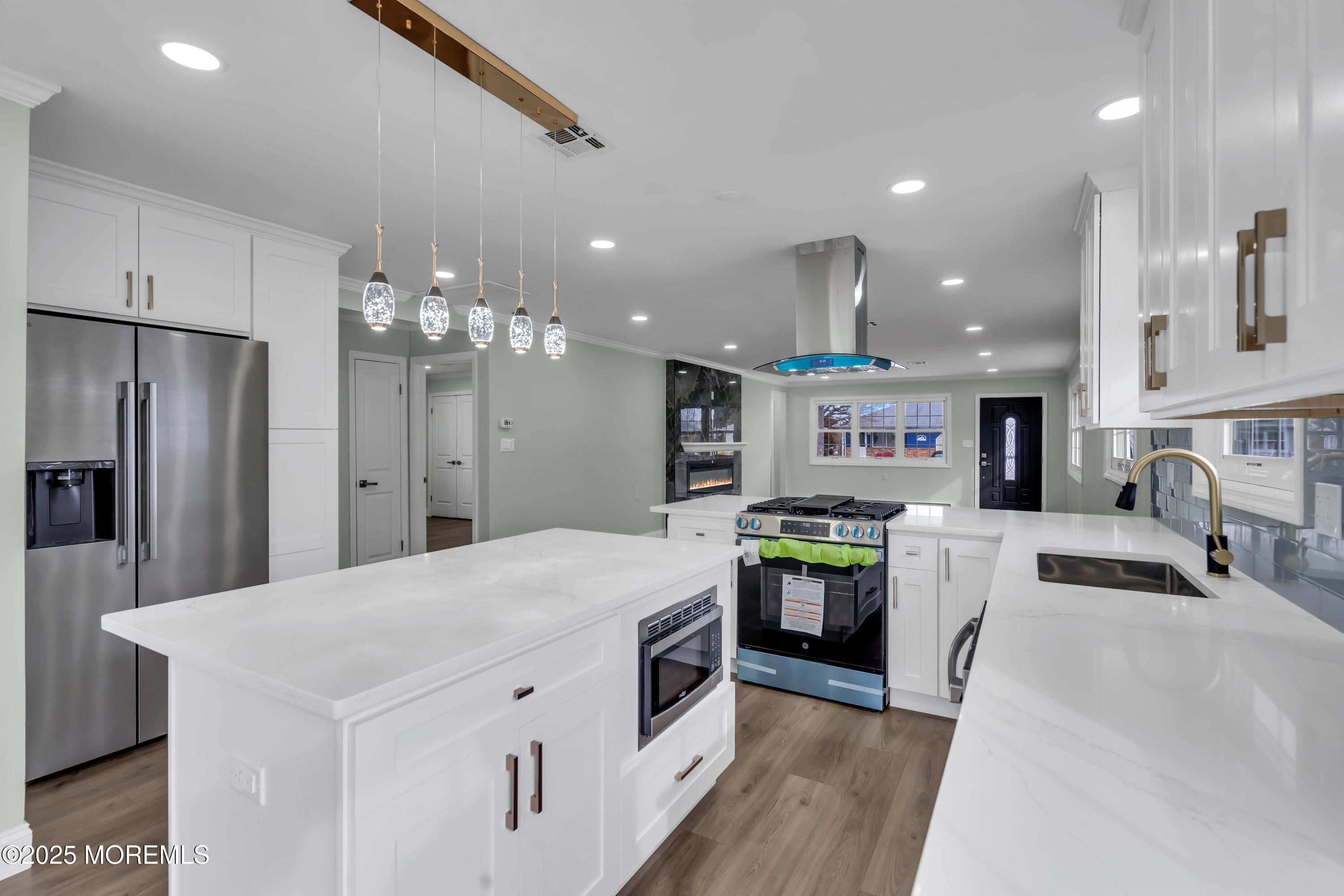 10 Aztec Court Toms River, NJ 08757 - Photo 38 of 57 a large kitchen with stainless steel appliances kitchen island a stove and a refrigerator