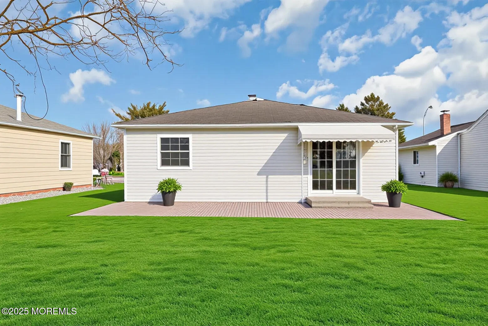 10 Aztec Court Toms River, NJ 08757 - Photo 57 of 57 a backyard of a house with table and chairs