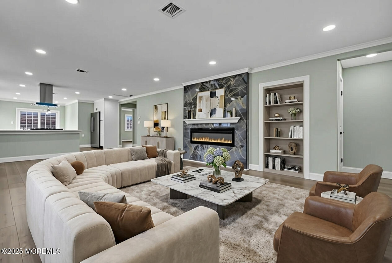 10 Aztec Court Toms River, NJ 08757 - Photo 8 of 57 a living room with furniture and a fireplace
