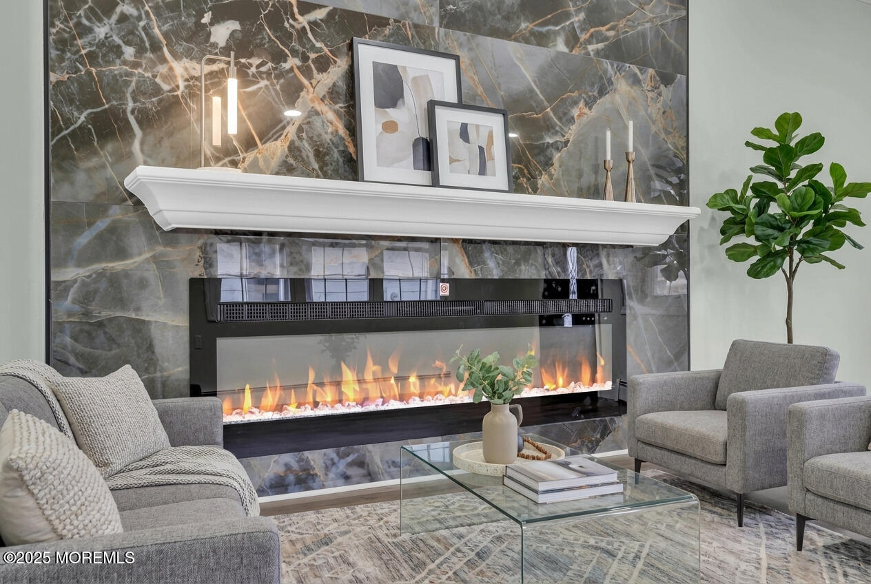 10 Aztec Court Toms River, NJ 08757 - Photo 9 of 57 a living room with furniture and a fireplace