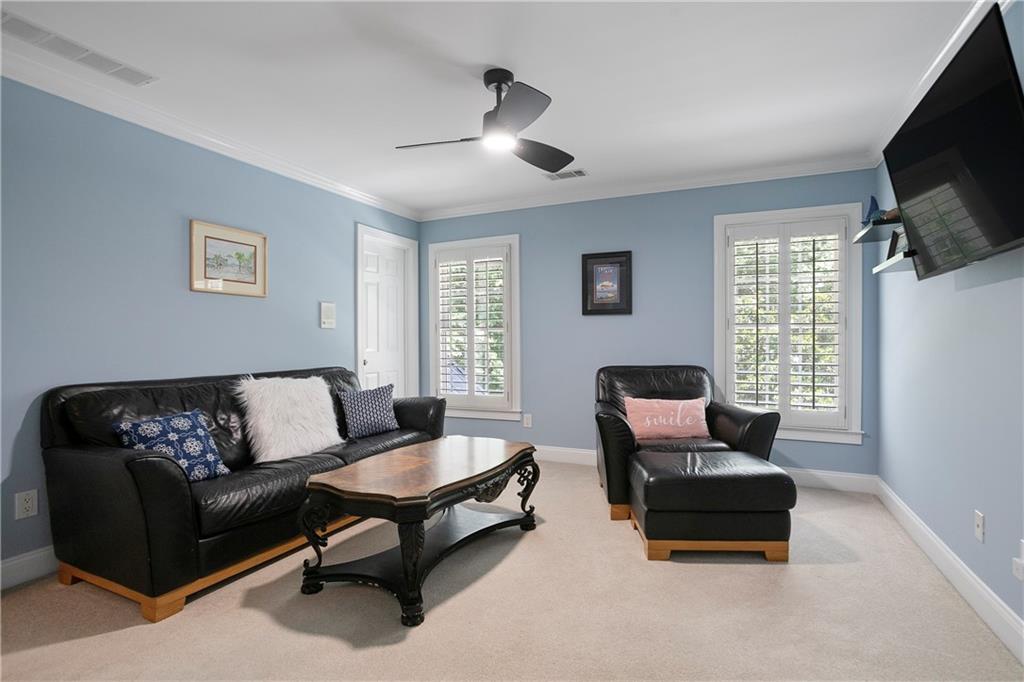 4185 Pool Road Winston, GA 30187 - Photo 32 of 51 a living room with furniture and a flat screen tv