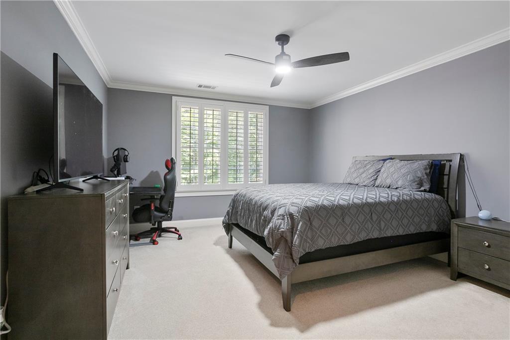 4185 Pool Road Winston, GA 30187 - Photo 35 of 51 a bedroom with a bed and a flat tv screen on the dresser