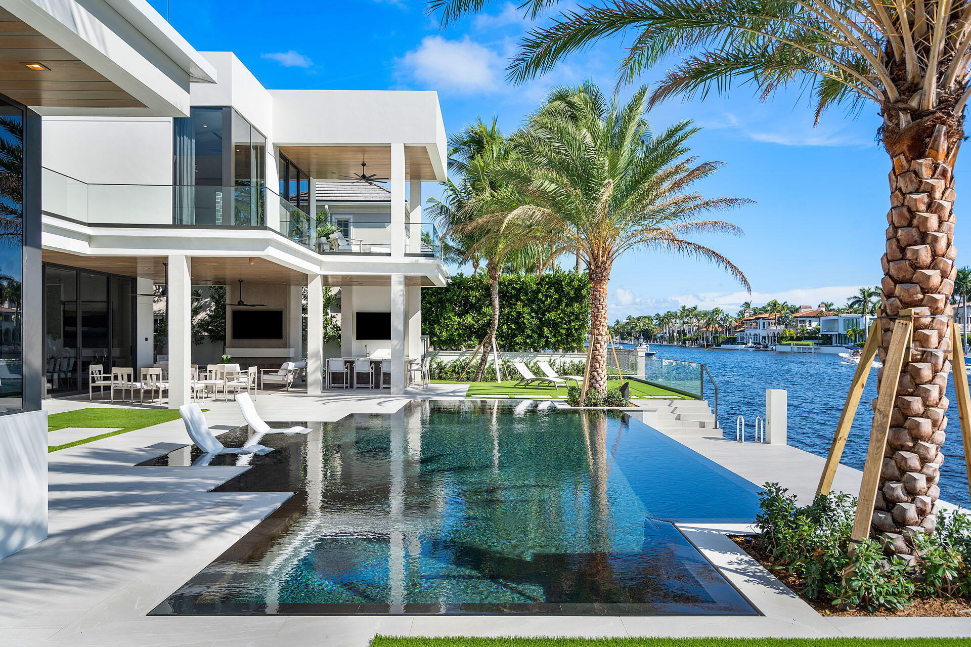 500 East Alexander Palm Road Boca Raton, FL 33432 - Photo 11 of 89 a view of a swimming pool with sitting area