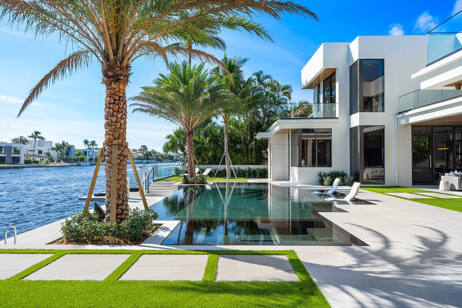 500 East Alexander Palm Road Boca Raton, FL 33432 - Photo 13 of 89 a view of a swimming pool with a patio