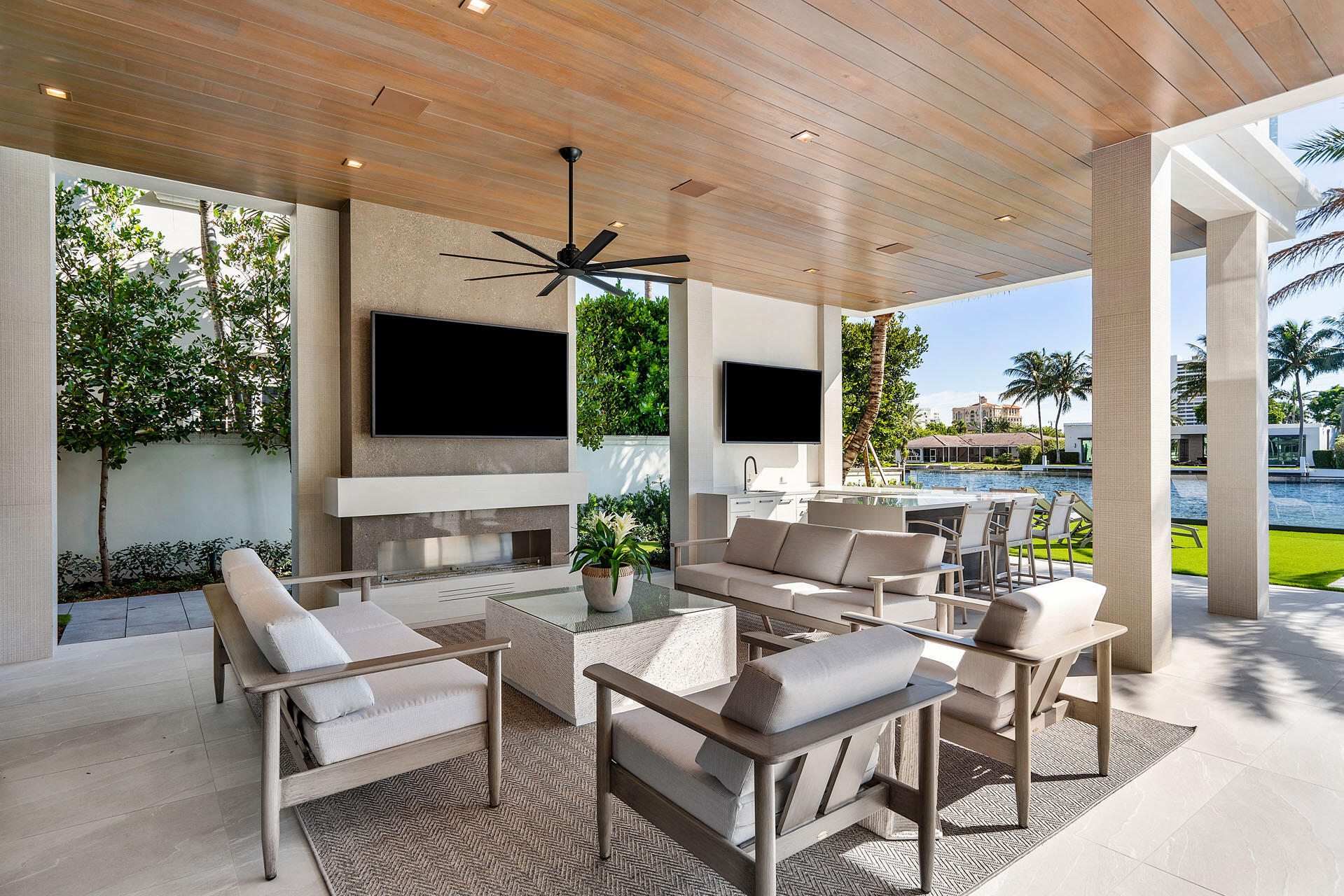 500 East Alexander Palm Road Boca Raton, FL 33432 - Photo 14 of 89 a living room with patio furniture and a flat screen tv