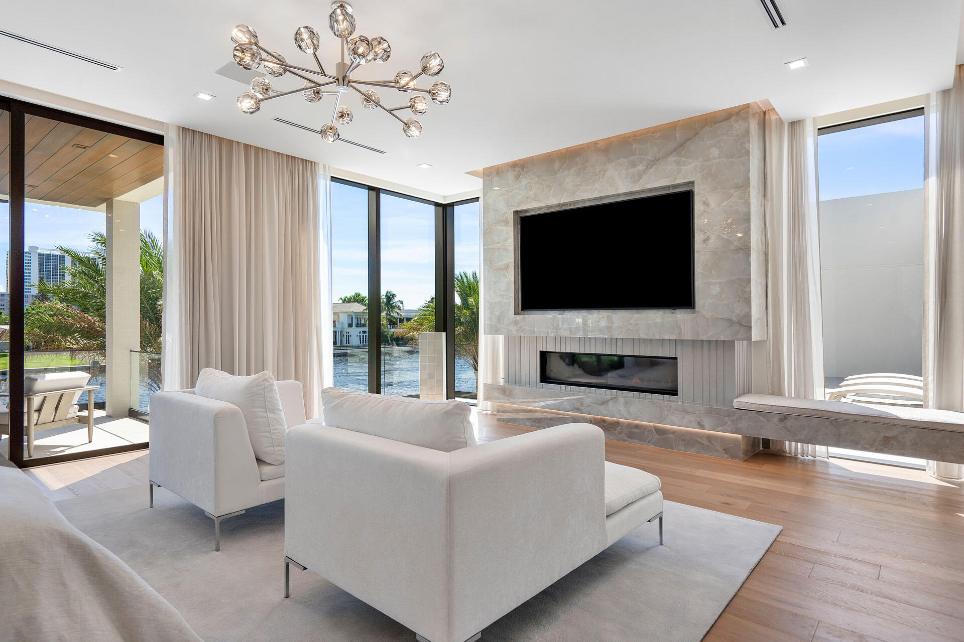 500 East Alexander Palm Road Boca Raton, FL 33432 - Photo 54 of 89 a living room with fireplace furniture and a flat screen tv