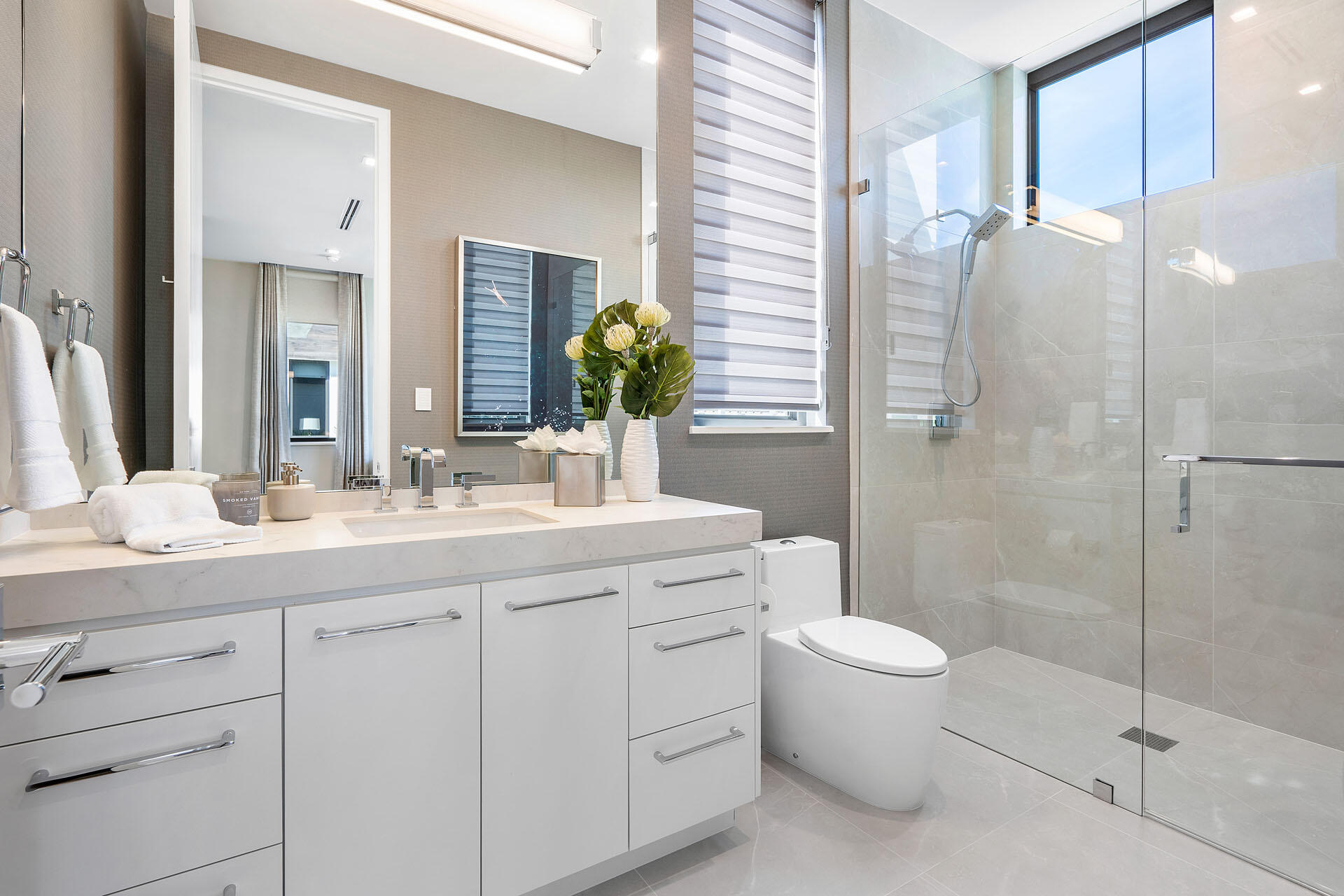 500 East Alexander Palm Road Boca Raton, FL 33432 - Photo 66 of 89 a bathroom with a double vanity sink toilet and shower