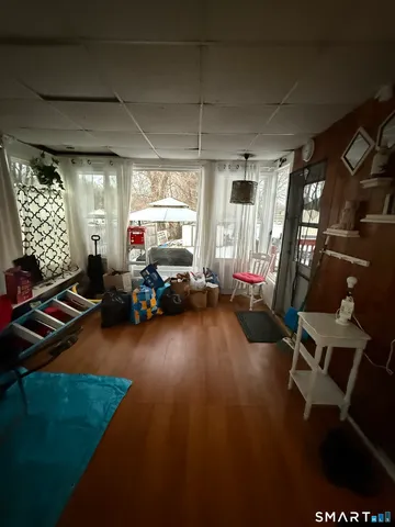 a gym area with gym equipment and windows