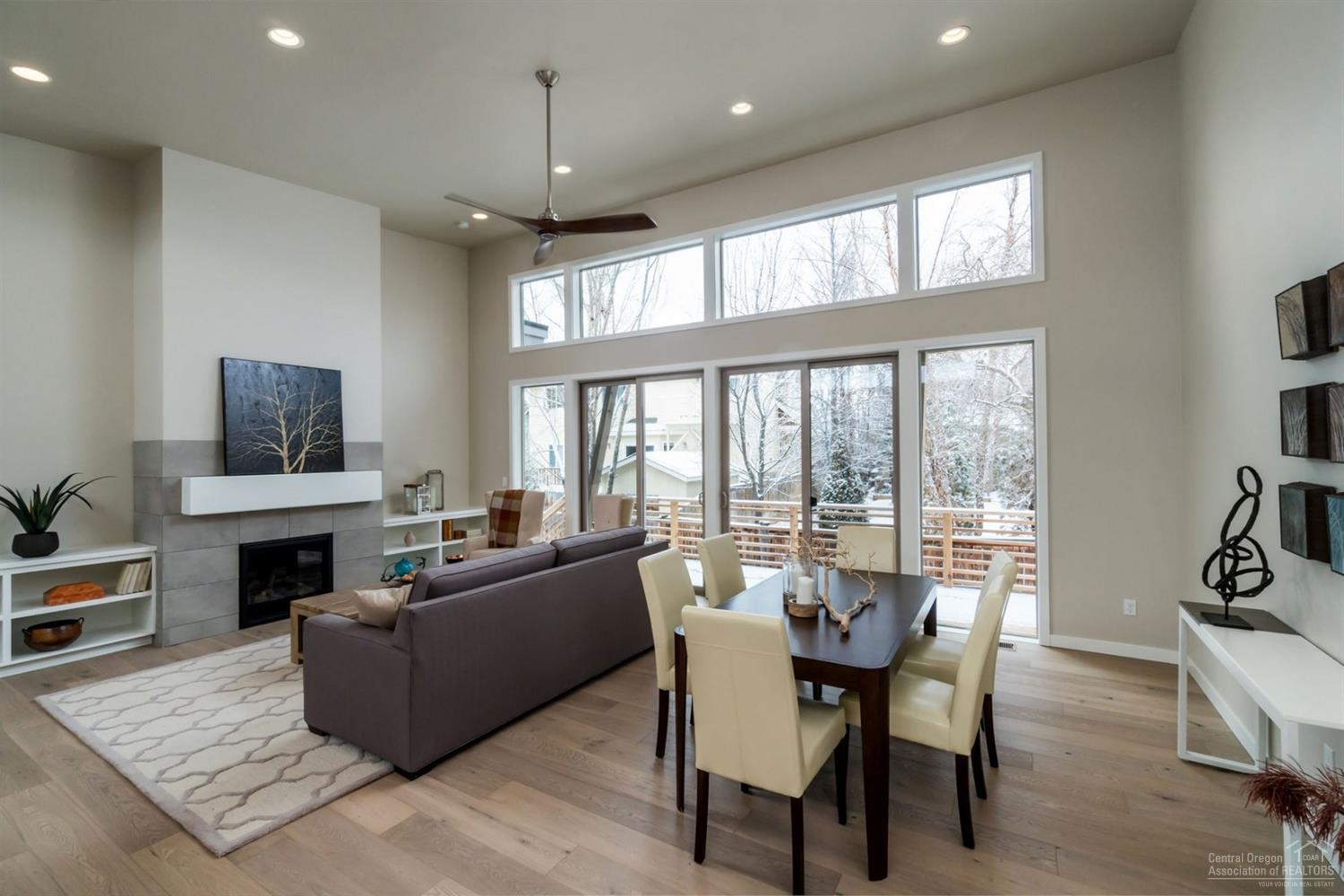 63193 Iner Loop Bend, OR 97701 - Photo 2 of 15 a living room with furniture a flat screen tv and a fireplace