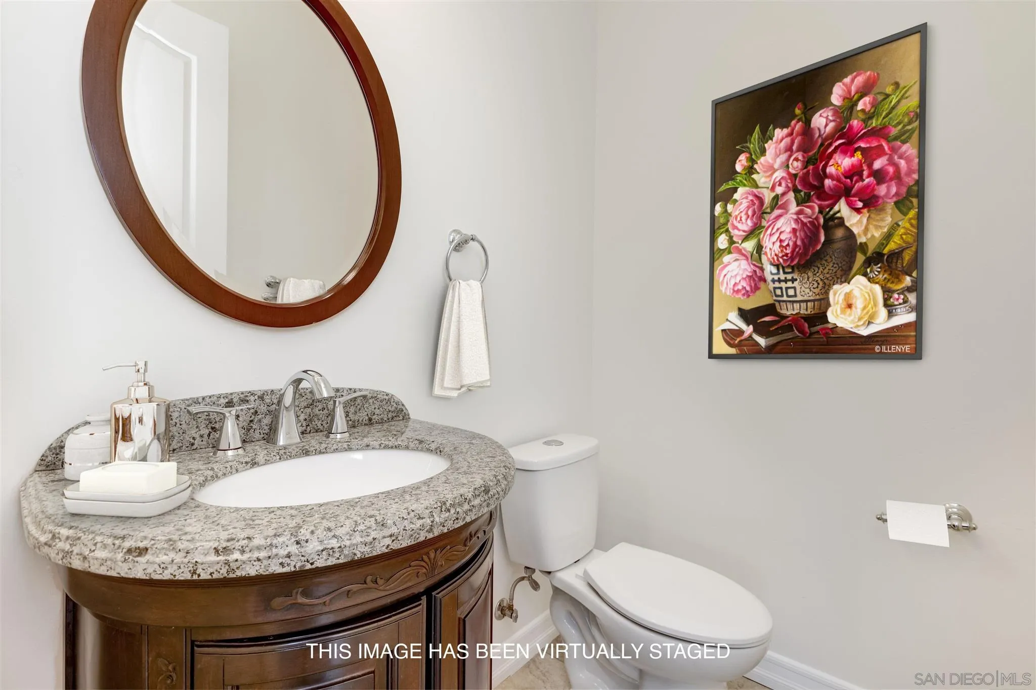 3650 Emma Road Vista, CA 92084 - Photo 14 of 25 a bathroom with a toilet a sink and a mirror