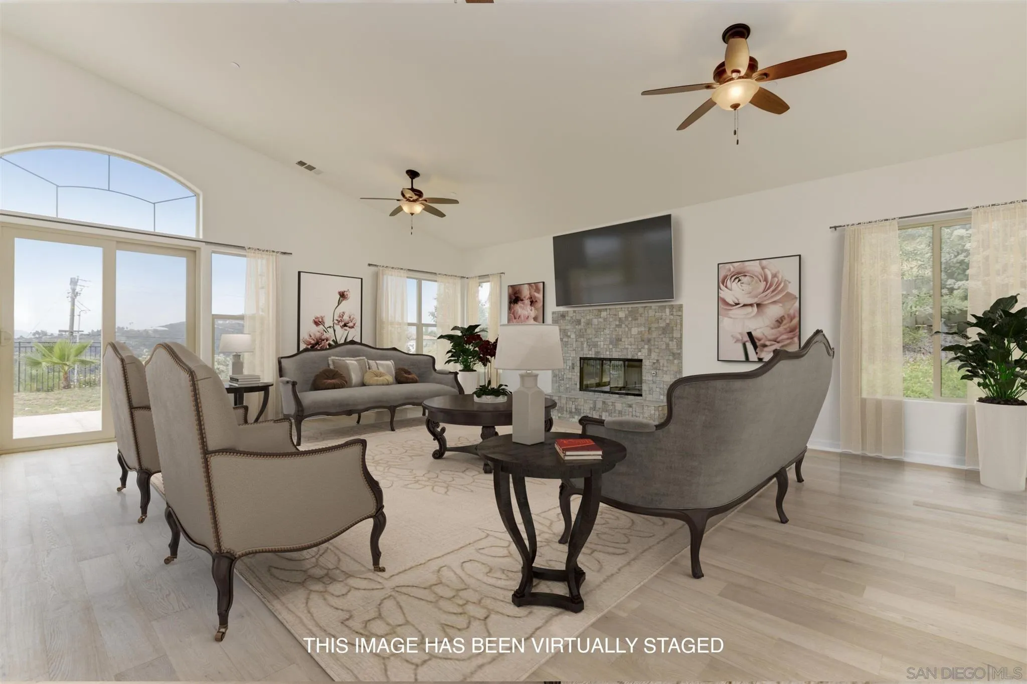 3650 Emma Road Vista, CA 92084 - Photo 7 of 25 a living room with furniture a fireplace and a flat screen tv