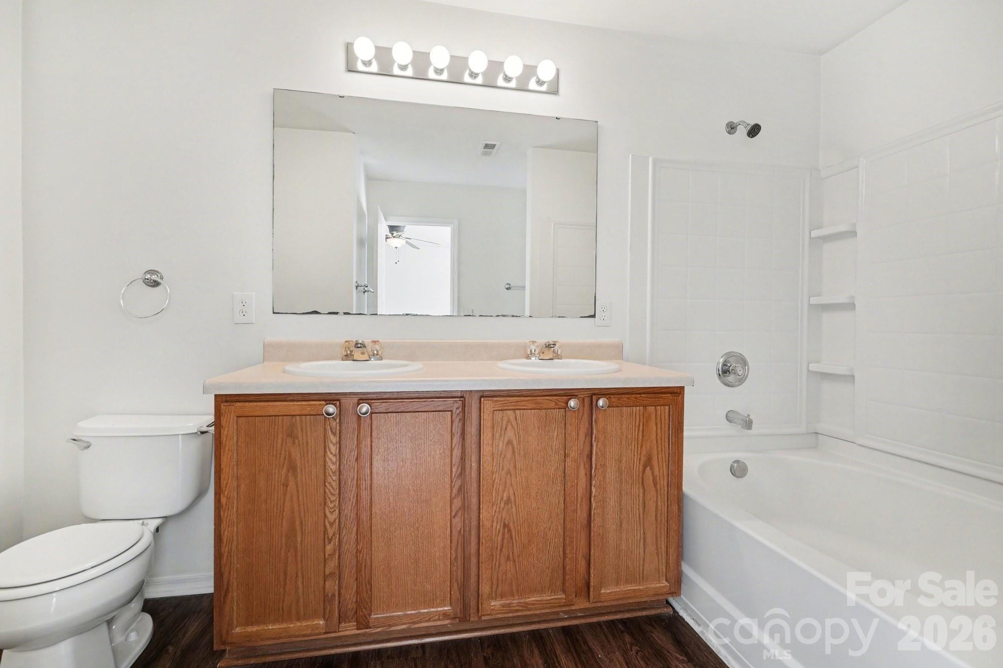 4400 Kiddle Lane Monroe, NC 28110 - Photo 20 of 28 a bathroom with a sink a toilet and bathtub