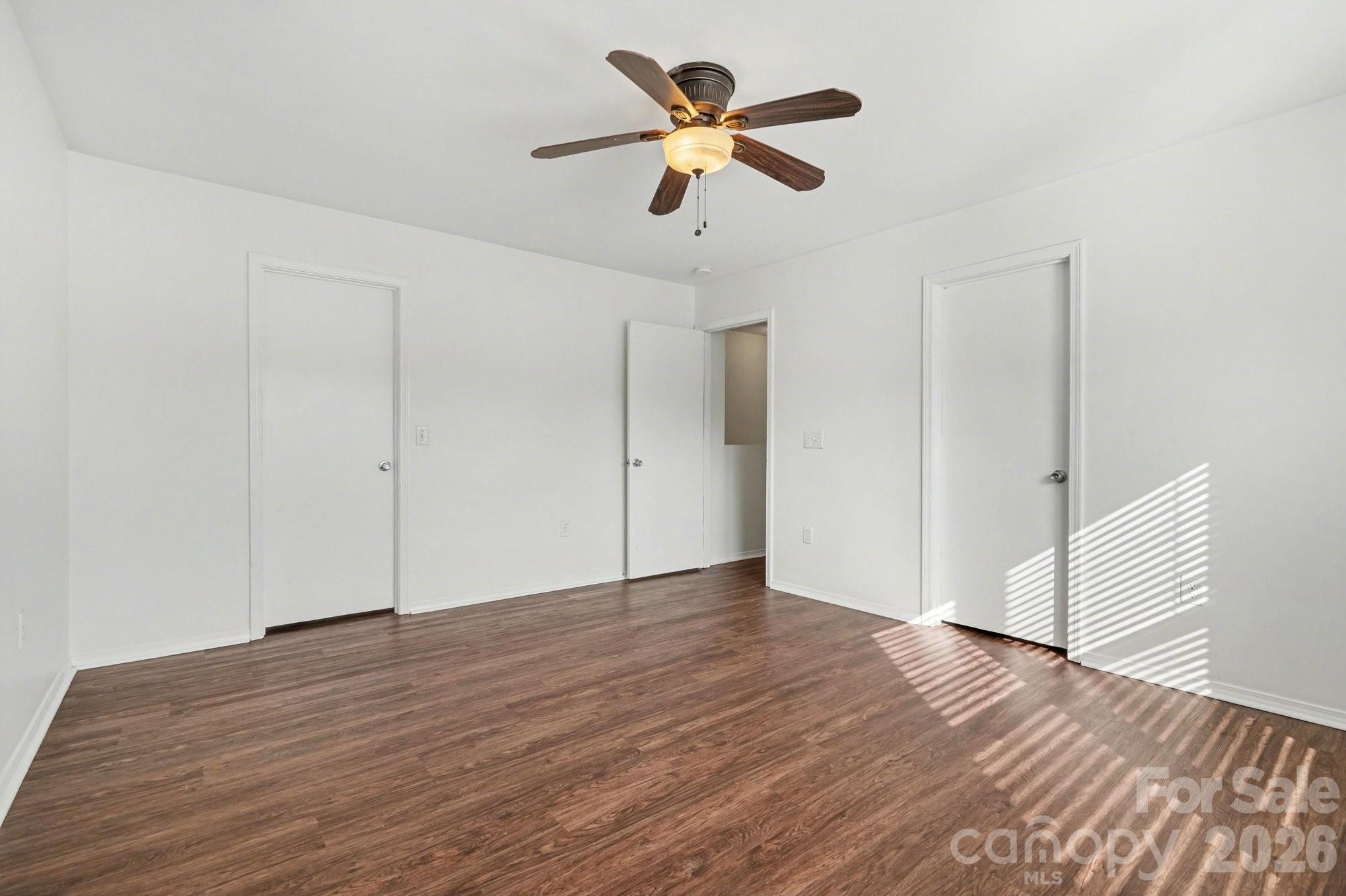 4400 Kiddle Lane Monroe, NC 28110 - Photo 21 of 28 a view of an empty room with wooden floor