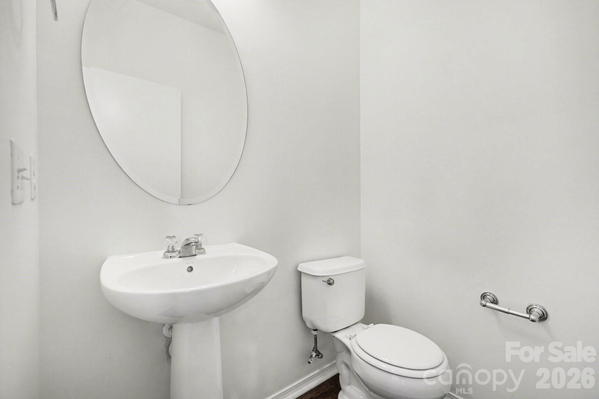 4400 Kiddle Lane Monroe, NC 28110 - Photo 5 of 28 a bathroom with a sink a toilet and a mirror