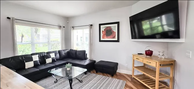 a living room with furniture and a flat screen tv