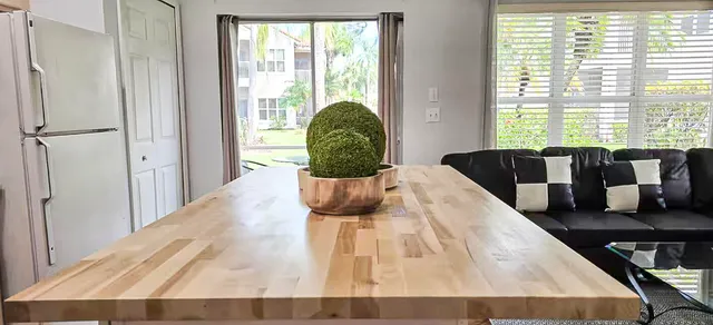 a living room with furniture rug and wooden floor