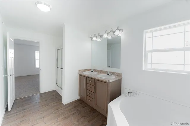 a view of utility room with wooden floor