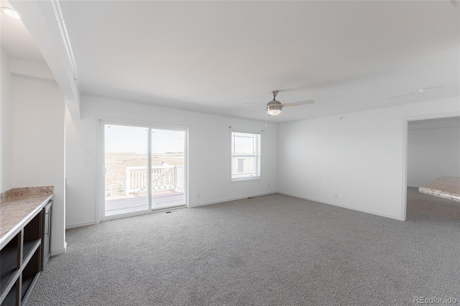 9 Timberlake Road Byers, CO 80103 - Photo 8 of 28 an empty room with windows