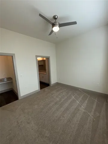 a view of a livingroom with a ceiling fan
