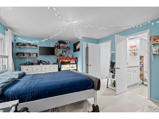 a bathroom with a sink a toilet and a shower curtain