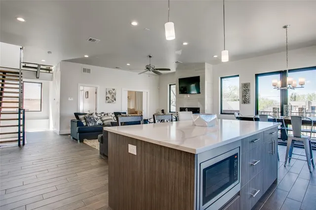 a view of a balcony with chair and wooden floor