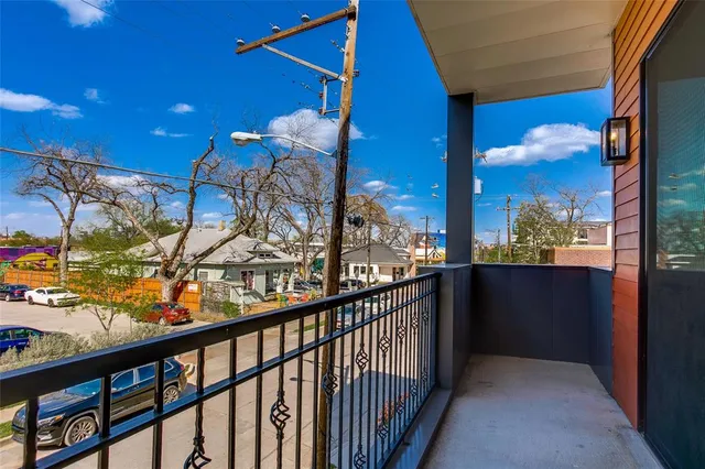 a kitchen with counter space sink appliances and wooden floor