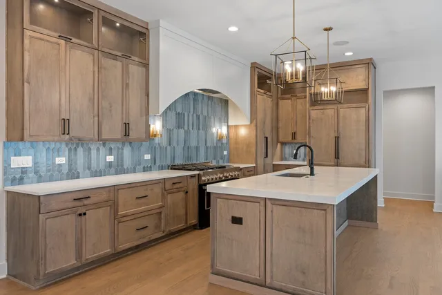 a kitchen with a sink and cabinets