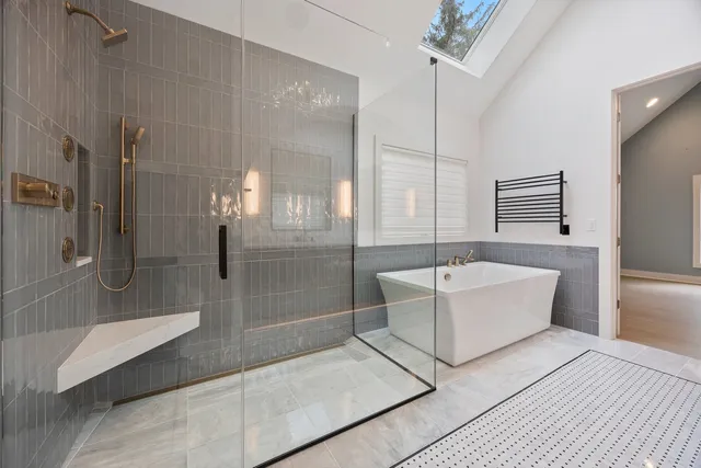 a bathroom with a bathtub and a shower